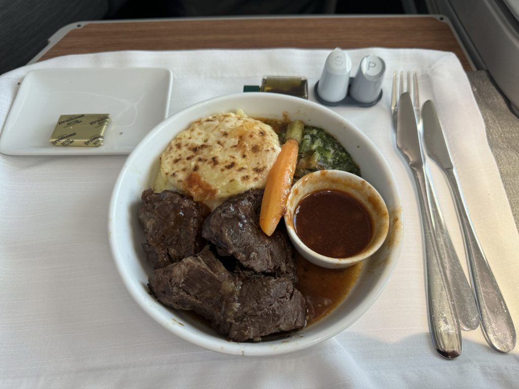 Braised beef meal in Business Class on American Airlines