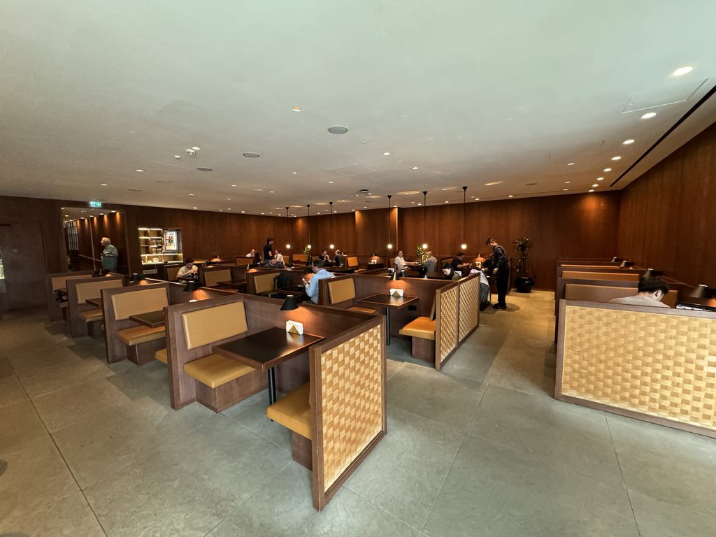 Dining room seating area at the Cathay Pacific Business Lounge in London